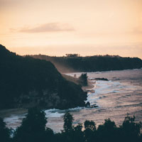 rocky ocean cliff at sunset